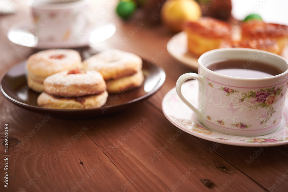 tea and sweets on a wooden table tea and sweets on a wooden table