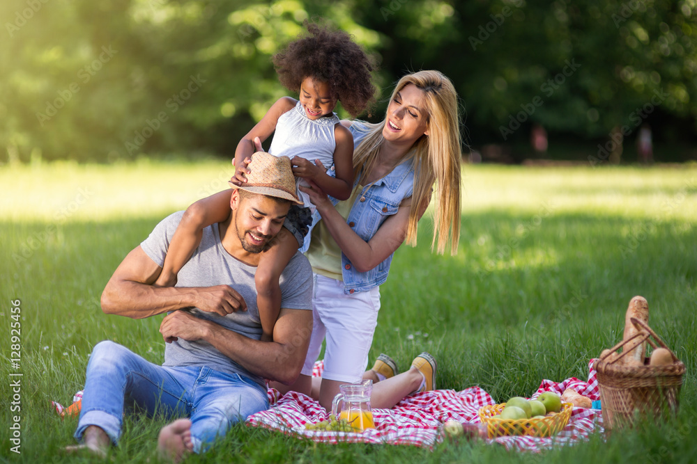 Happy family enjoying picnic Happy family enjoying picnic