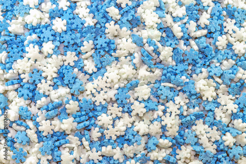 Tiny blue and white snowflake shaped baking sprinkles