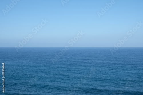 ocean horizon - clear blue sky background