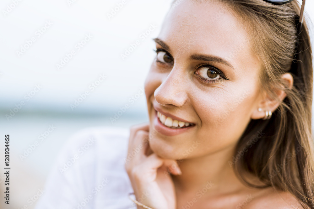 Portrait of a beautiful young woman posing outdoors Portrait of a beautiful young woman posing outdoors