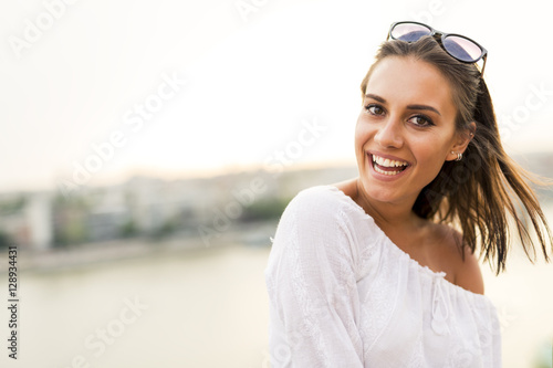 Portrait of a beautiful young woman posing outdoors