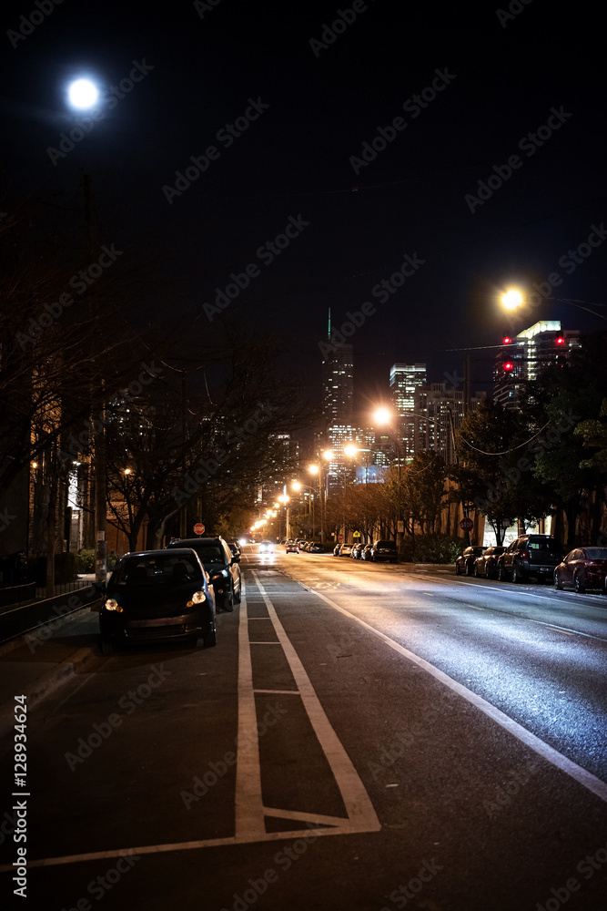 Dark City Street at Night with Moon