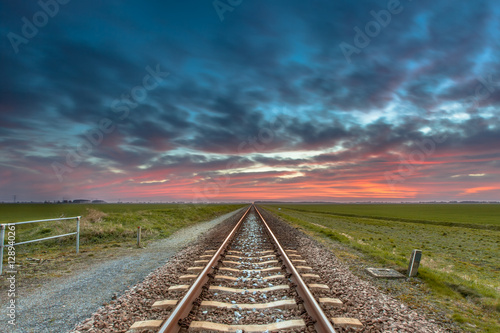 Endless railroad in open rural countryside
