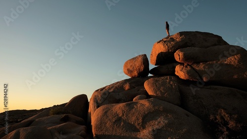 Man On top of giant rocks 
