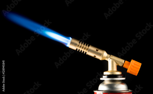 manual gas burner with blue flame photo