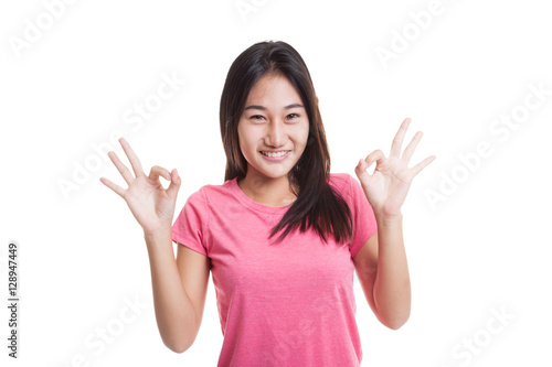 Asian woman show double OK hand sign  and smile