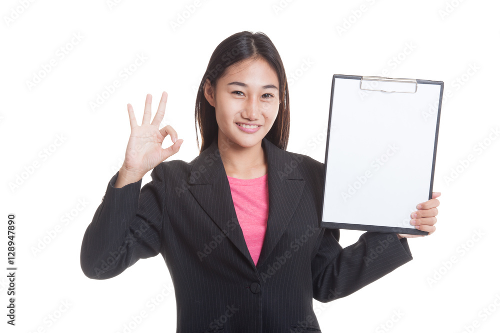 Young Asian business woman show OK and blank clipboard isolated on white background Young Asian business woman show OK and blank clipboard isolated on white background
