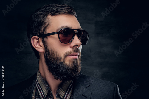 Close up portrait of bearded male in sunglasses.