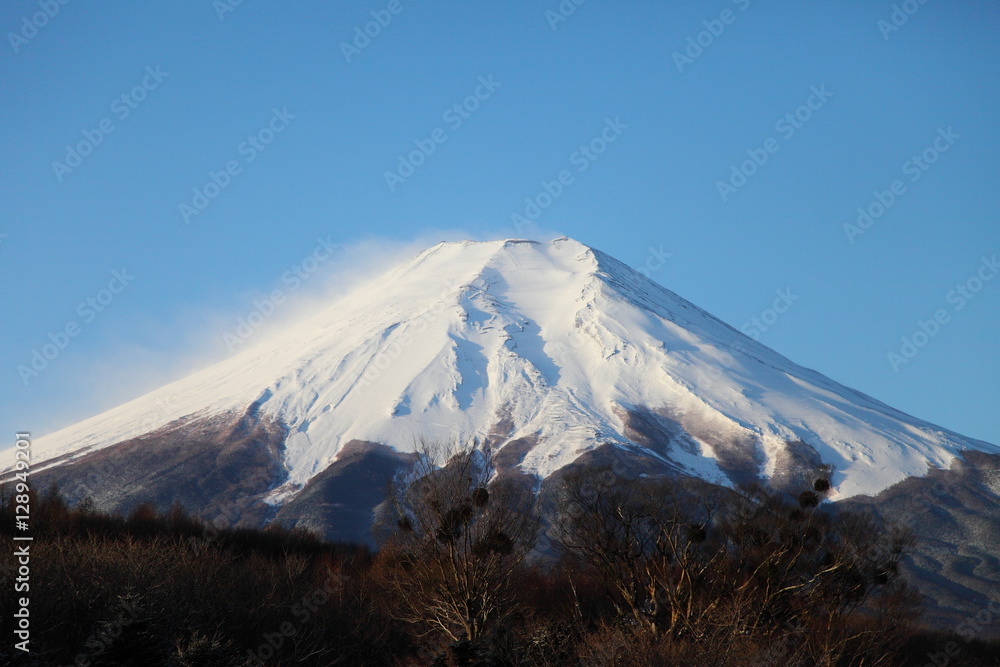 Snow on top of Mt.Fuji with lights of sunrise.