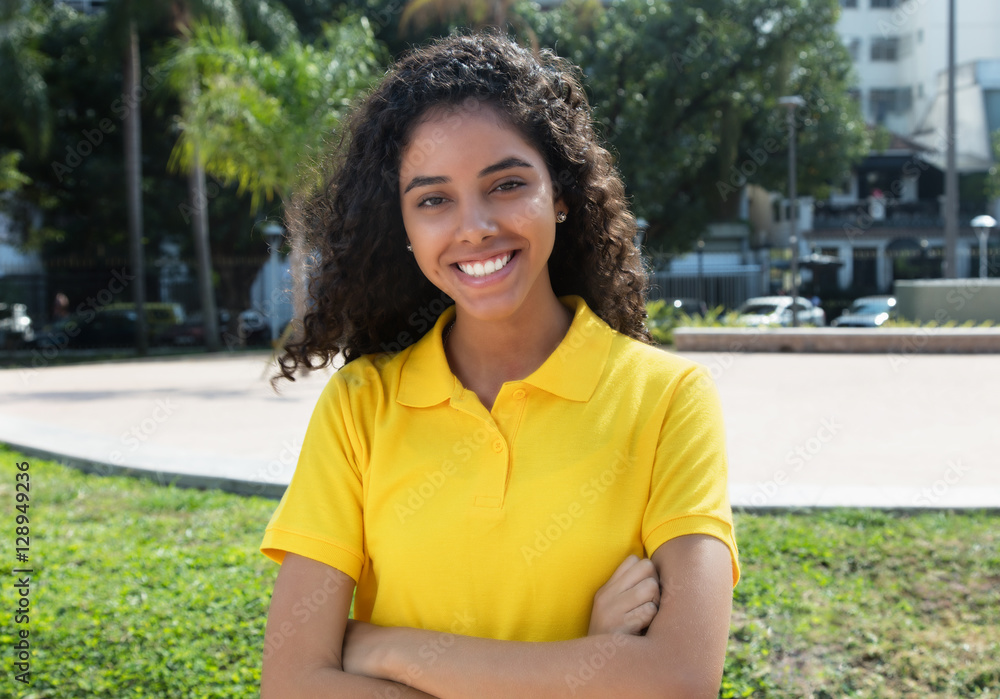 Beautiful latin american girl with long dark hair and crossed ar Beautiful latin american girl with long dark hair and crossed ar