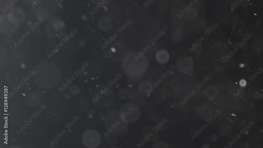 black and white backlit dust particles explosion and floating in slow motion, 180fps prores footage black and white backlit dust particles explosion and floating in slow motion, 180fps prores footage