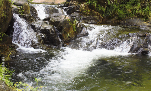 Fototapeta Naklejka Na Ścianę i Meble -  Waterfall form river soft focus background.