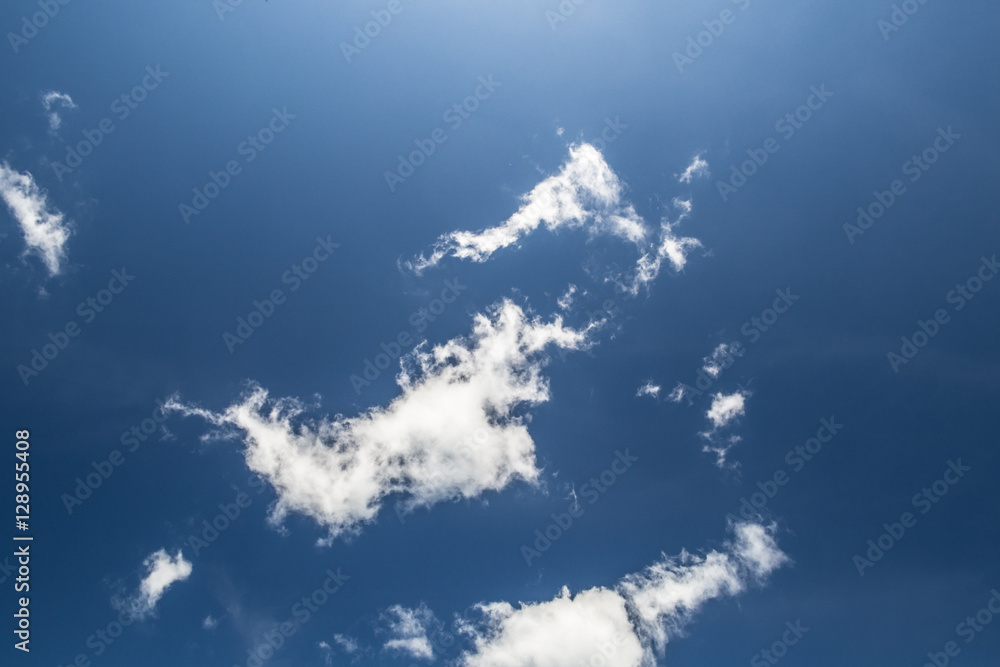 Deep blue sky with white cloud. Light from above. Deep blue sky with white cloud. Light from above.