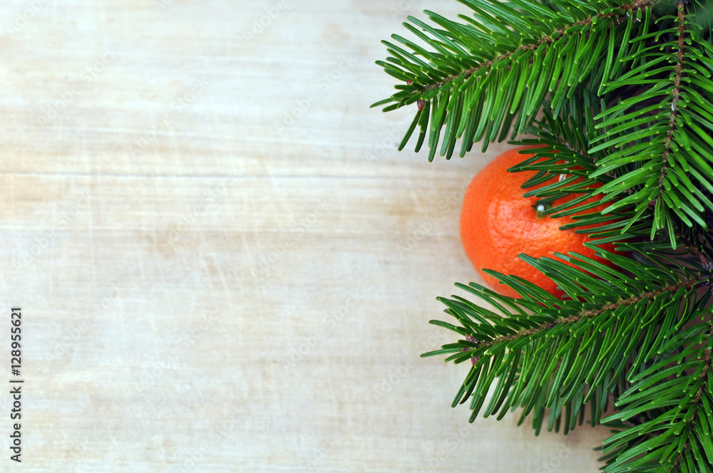 Fresh Clementines or Tangerines on Brown Wooden Table with Xmas Fresh Clementines or Tangerines on Brown Wooden Table with Xmas