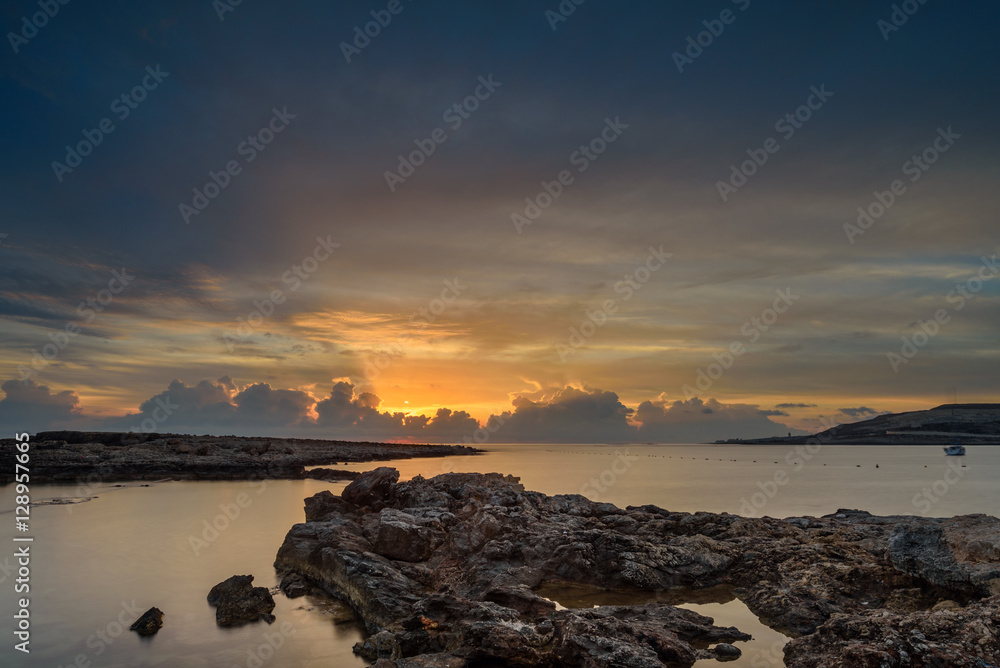 Fototapeta premium Amazing seascape sunrise, Malta. colorful sky