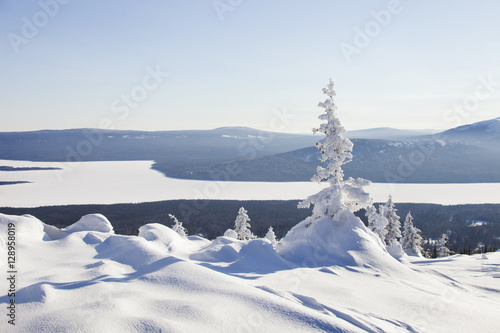 View of the lake from mountain range Zyuratkul, winter. Snow cov