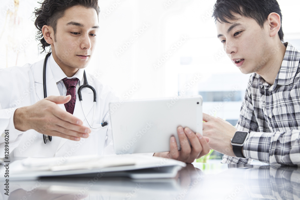 A young man is undergoing medical examination in internal medicine A young man is undergoing medical examination in internal medicine