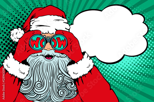 Wow pop art Santa Claus with open mouth holding binoculars in his hands with inscription wow in reflection and speech bubble. Vector illustration in retro pop art comic style. Christmas invitation.