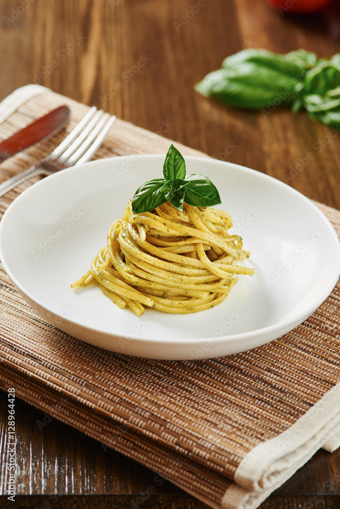 Pasta with pesto sauce in white dish Pasta with pesto sauce in white dish
