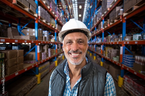 Portrait of smiling warehouse worker wearing hard hat © WavebreakMediaMicro
