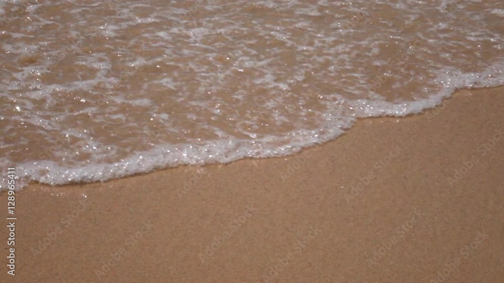 Meditative slow motion, 240fps, of flat sea wave with white foam on brown sand beach. Natural background for amazing intro in excellent eight times decelerated clip. Relaxing view of vacation scene. Meditative slow motion, 240fps, of flat sea wave with white foam on brown sand beach. Natural background for amazing intro in excellent eight times decelerated clip. Relaxing view of vacation scene.
