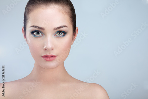 Beautiful woman face. Perfect makeup. Beauty fashion. Eyelashes. Lips. Cosmetic Eyeshadow. Perfect skin