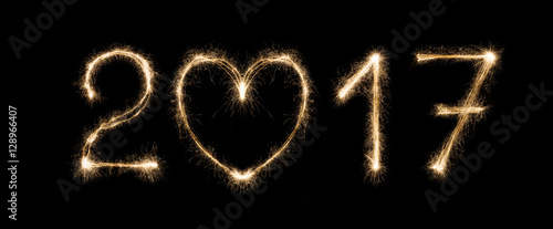 New year date, sparkler numbers on black background