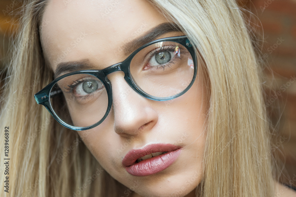 young business woman blonde in glasses in cafe young business woman blonde in glasses in cafe