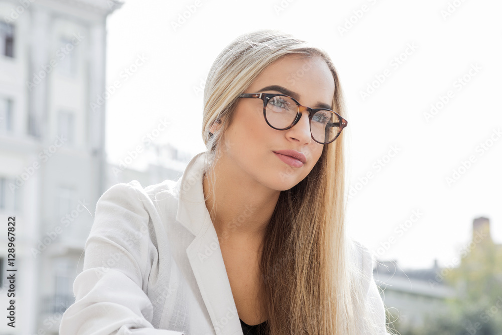 young business woman, blond, bespectacled, Outdoor young business woman, blond, bespectacled, Outdoor