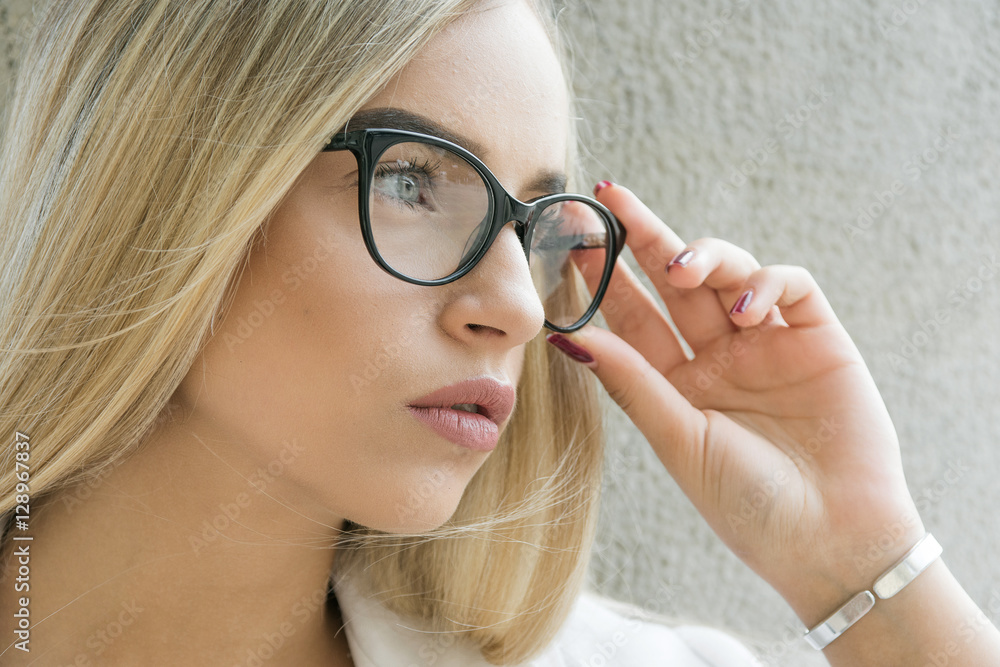 young business woman, blond, bespectacled, Outdoor young business woman, blond, bespectacled, Outdoor