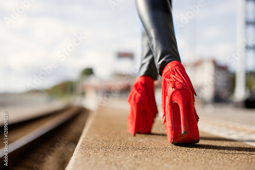 Woman walking in red high heels
