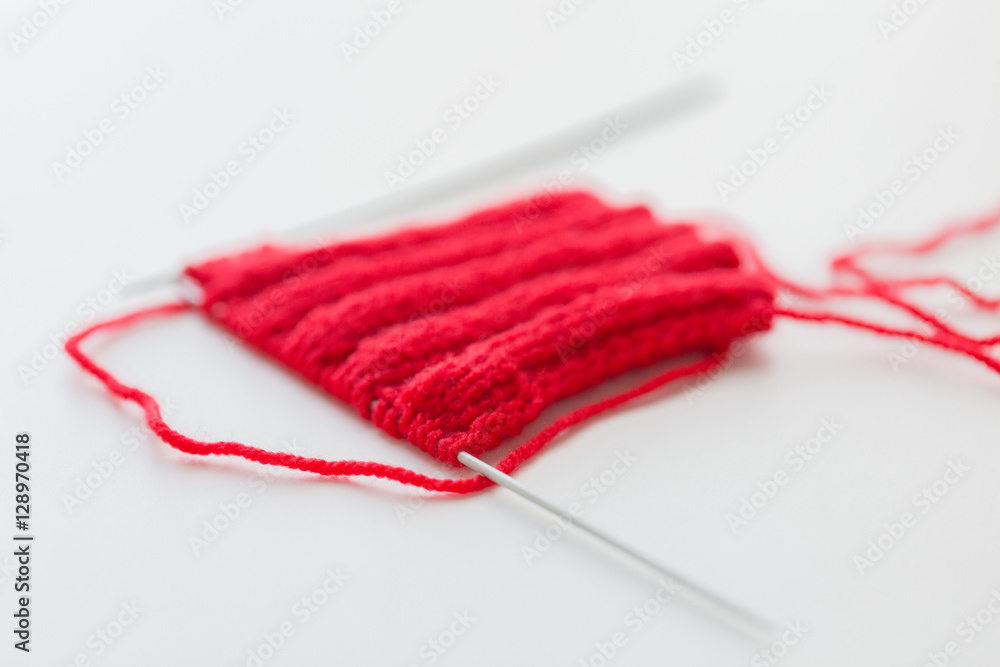 hand-knitted item with knitting needles hand-knitted item with knitting needles