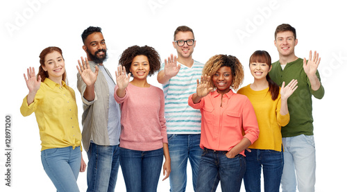 international group of happy people waving hand