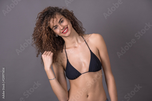 beautiful curly girl smiling, laughing, fooling around, having f