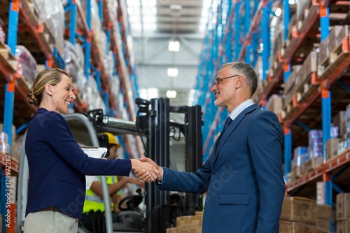 Warehouse manager shaking hands with client © WavebreakMediaMicro