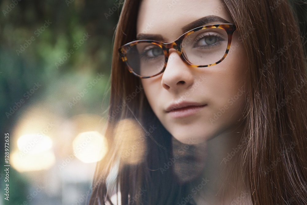 close up Portrait of a girl in glasses