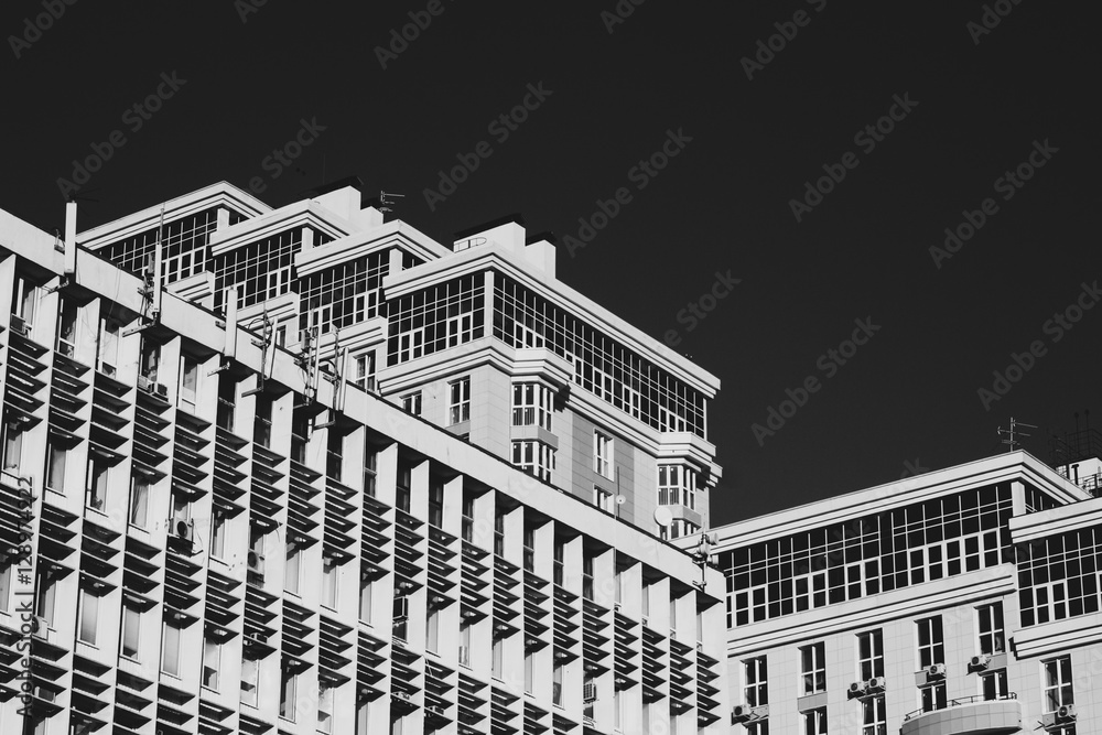 top of a modern building, black and white image
