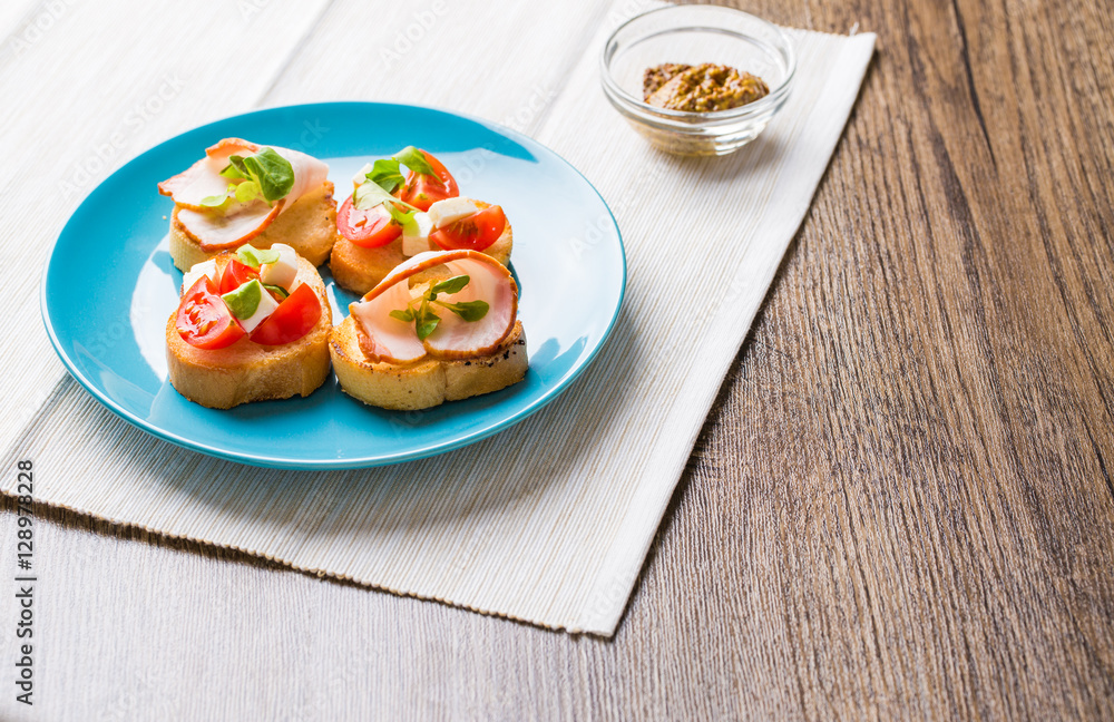Bruschetta with tomato, cheese and bacon Bruschetta with tomato, cheese and bacon