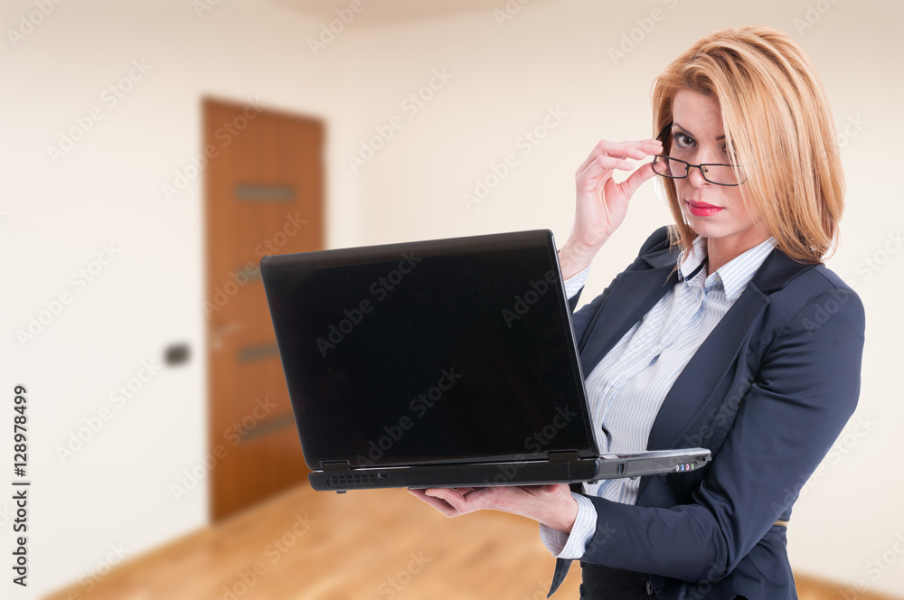 Attractive female agent browsing on laptop Attractive female agent browsing on laptop