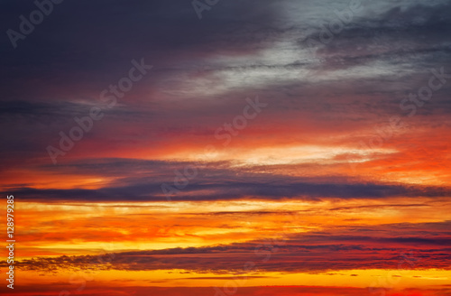 Beautiful apocalyptic fiery sunset sky as background. © es0lex