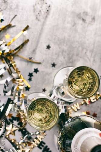 NYE: Champagne To Celebrate New Year On Grunge Background