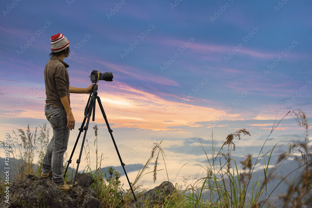 Photographer take a picture on the top of Mountain