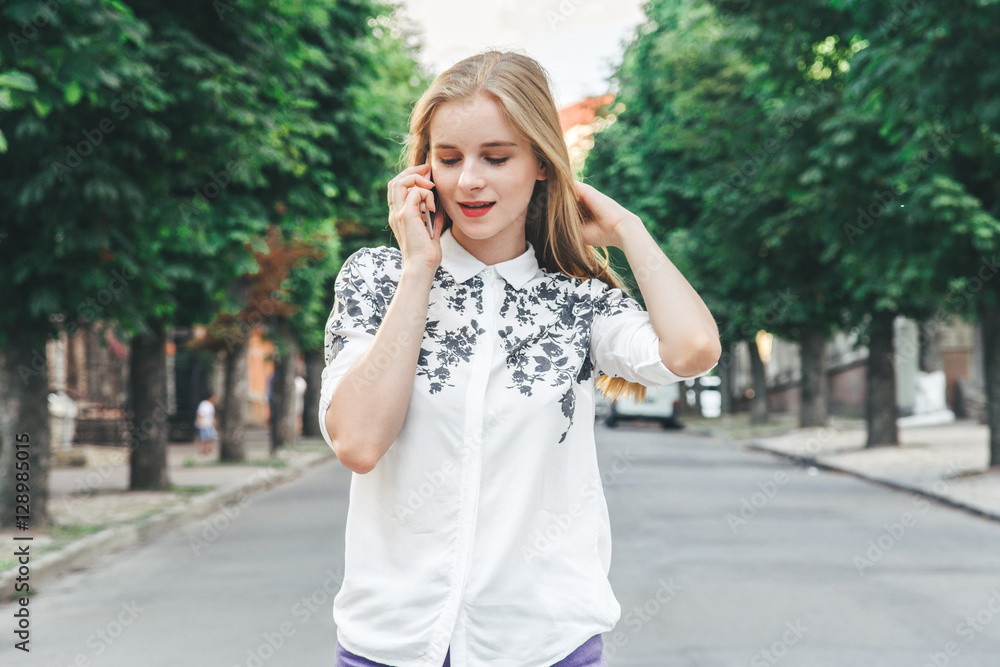 Young pretty beautiful woman girl talking on mobile phone. Young pretty beautiful woman girl talking on mobile phone.