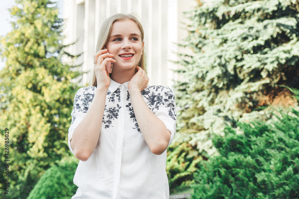 Young pretty beautiful woman girl talking on mobile phone. Young pretty beautiful woman girl talking on mobile phone.