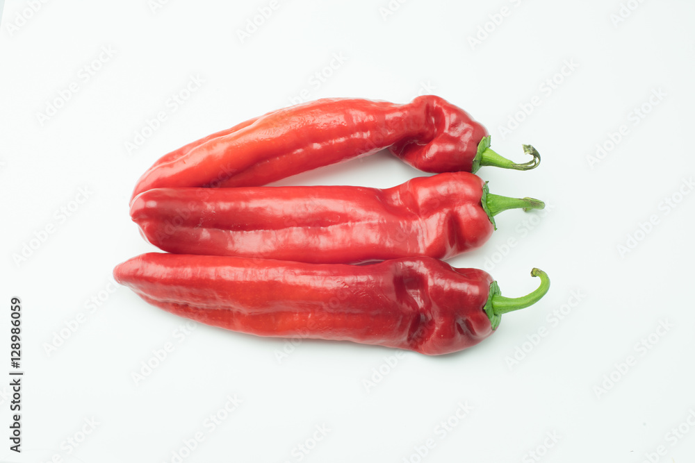 fresh sweet red peppers paprika isolated on white background