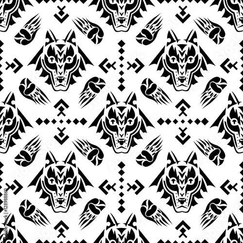 Vector illustration seamless geometric pattern with  wolf head in american indian folk style.