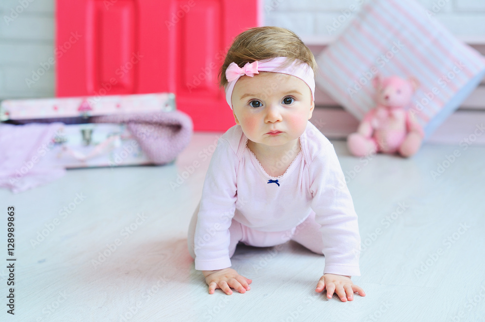 Adorable smiling baby girl crawling Adorable smiling baby girl crawling