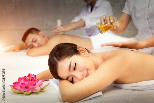 Beautiful woman having a wellness back massage and feeling visibly good about it