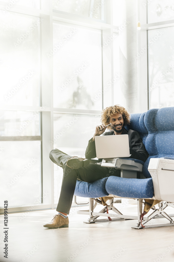 Successful young businessman using laptop Successful young businessman using laptop